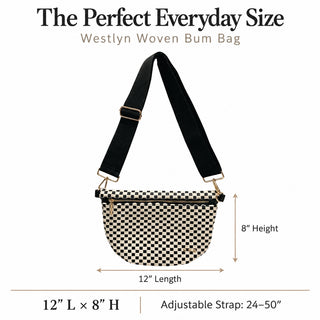 A Westlyn Woven Bum Bag with a black and beige checkerboard pattern, black adjustable shoulder strap, and gold-tone hardware, shown with dimension labels indicating 12" length, 8" height, and strap length on a white background.
